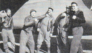 Left-to-Right: Staff Sgt. Vernon L. Moore, 2nd Lt. Lieutenant Hays, 2nd Lt. John S. Woravka, Staff Sgt. Guy E. Shelley, and Technical Sgt. Harold J. Ripslinger
